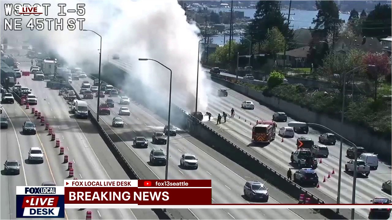 Burning car blocks lanes of I-5 in Seattle