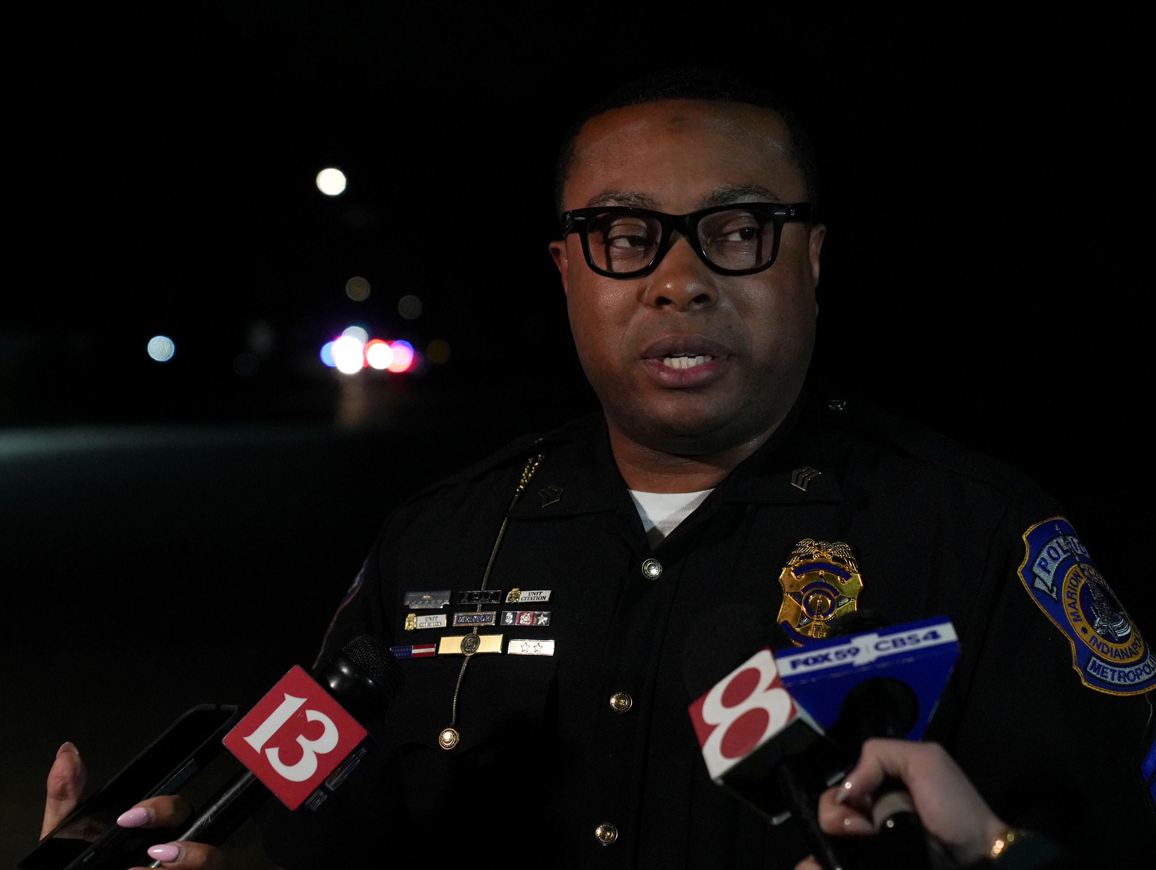 IMPD officer returns fire on man shooting from upstairs apartment