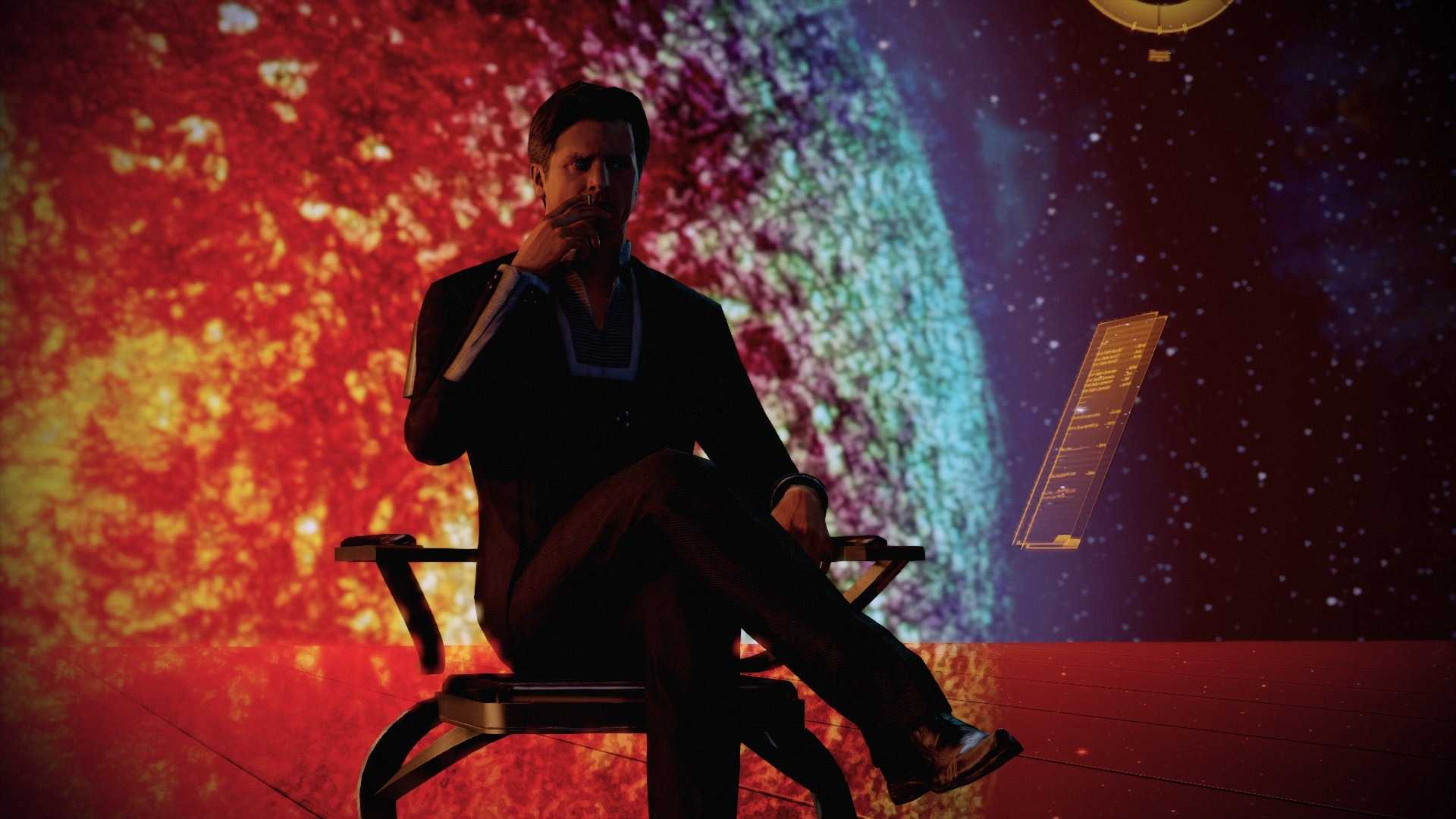 The Illusive Man sits in a chair in Mass Effect 2