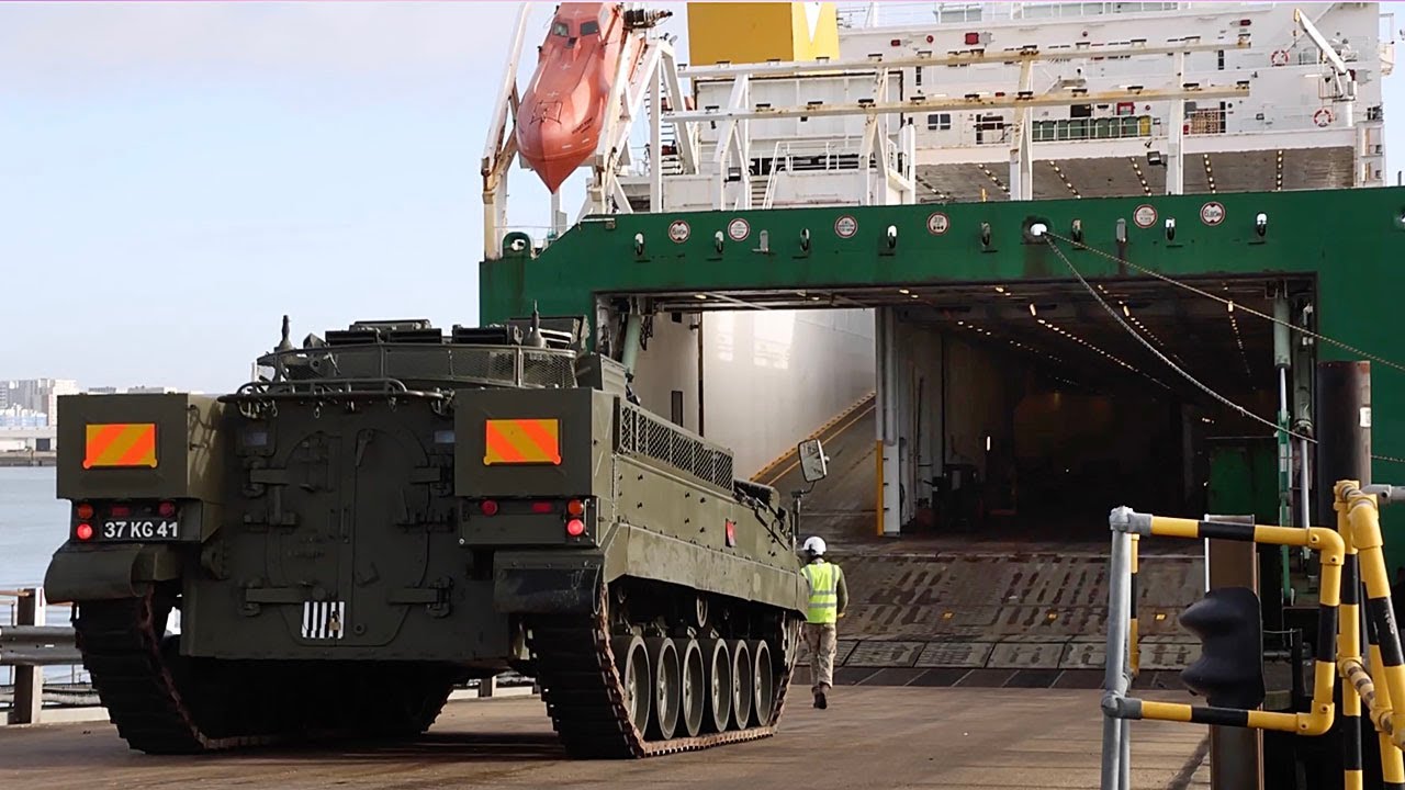 British Army vehicles being loaded for transport to Estonia the day ...