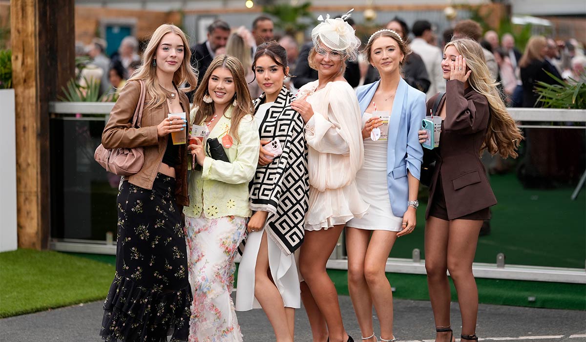PICS: Polka dots and pink shine bright as Aintree Races gets off to a ...