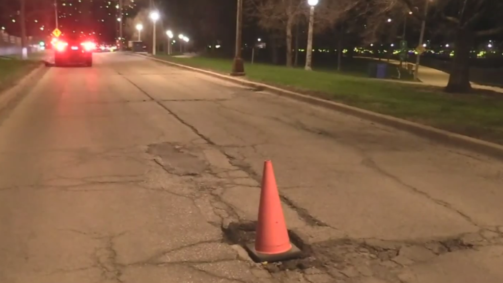 Large pothole on DuSable Lake Shore Drive on Belmont ramp leaves cars ...