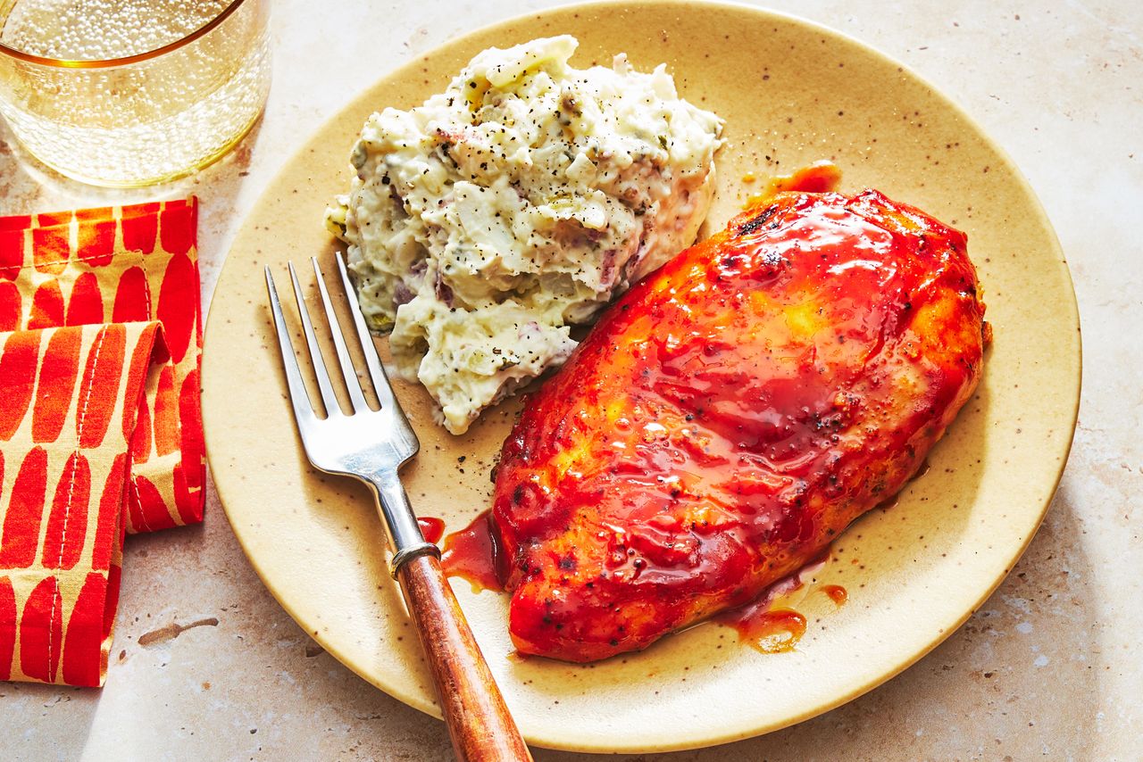 Southern Living BBQ Chicken Breasts on a plate to serve with potato salad