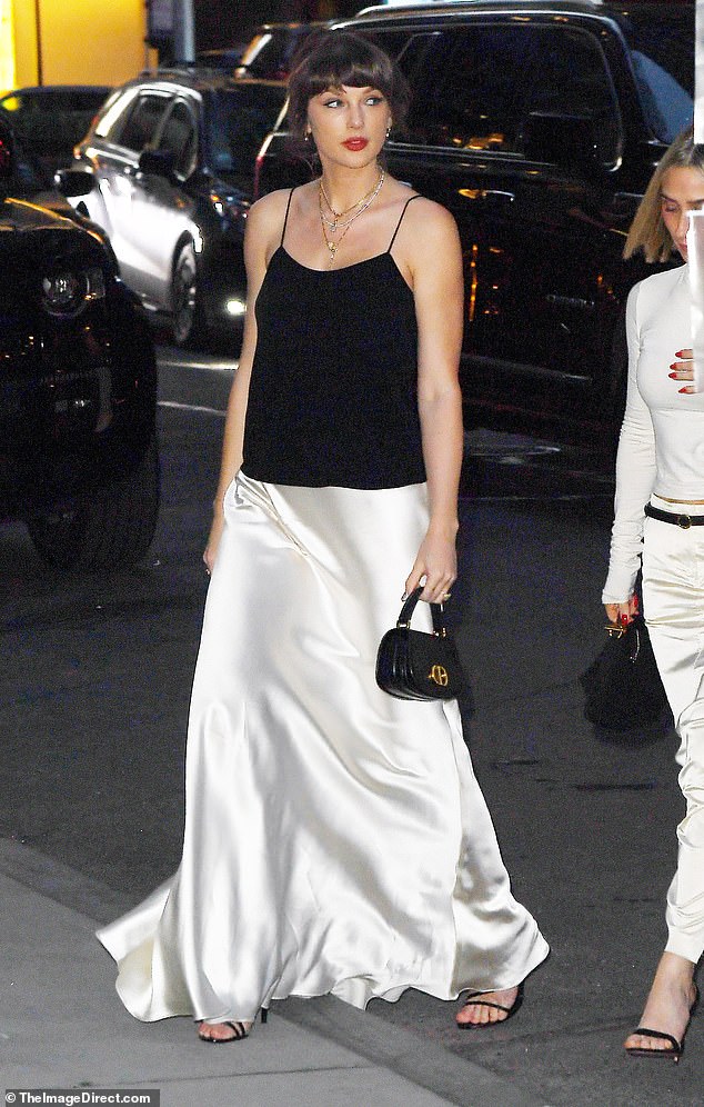 Taylor Swift wows in bridal-inspired ivory satin skirt ahead of summer ...
