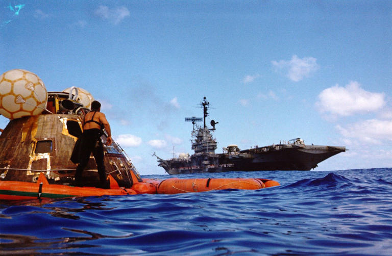 Why will the Artemis II spacecraft land in the ocean and not on land?