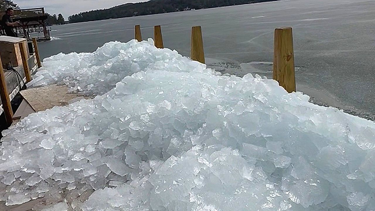 Ice appears to climb a ramp onto a dock - and there's a good reason why