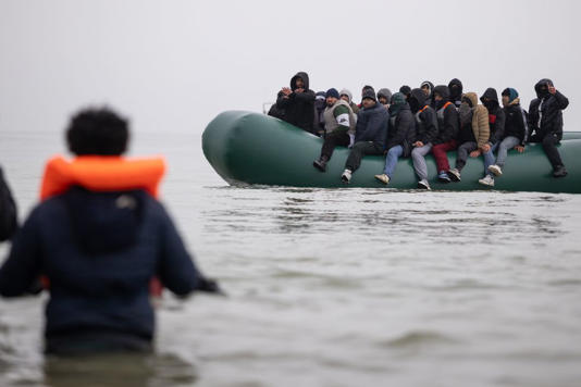 Migrants on board a dinghy on the coast off Gravelines, France | Source: GETTY
