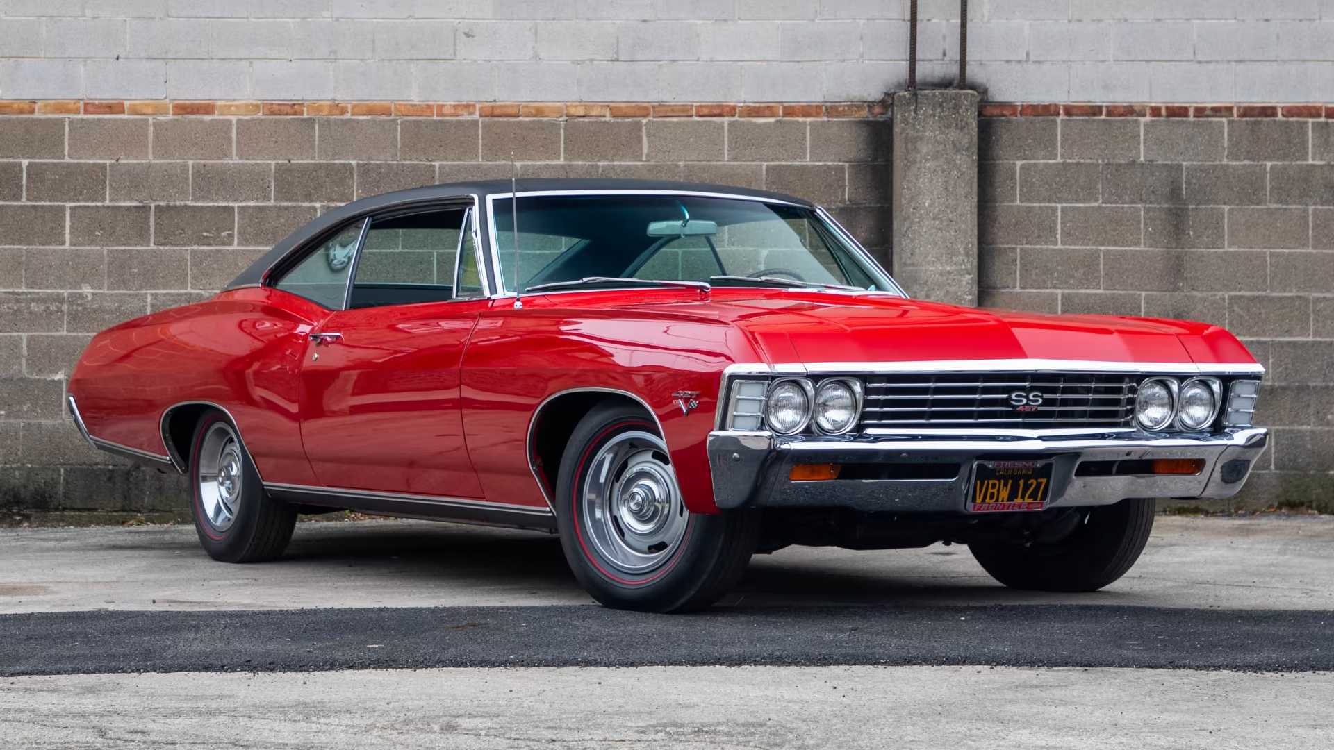 red 1967 Chevy Impala SS 427 parked outside