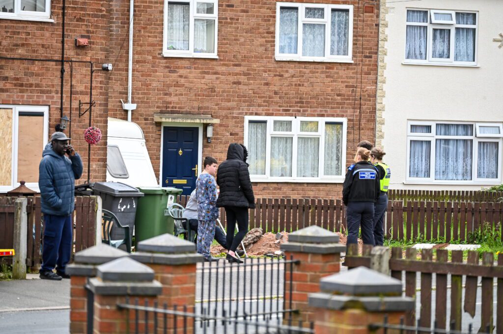 Woman, aged in her 70s, dies after being attacked by two dogs at house