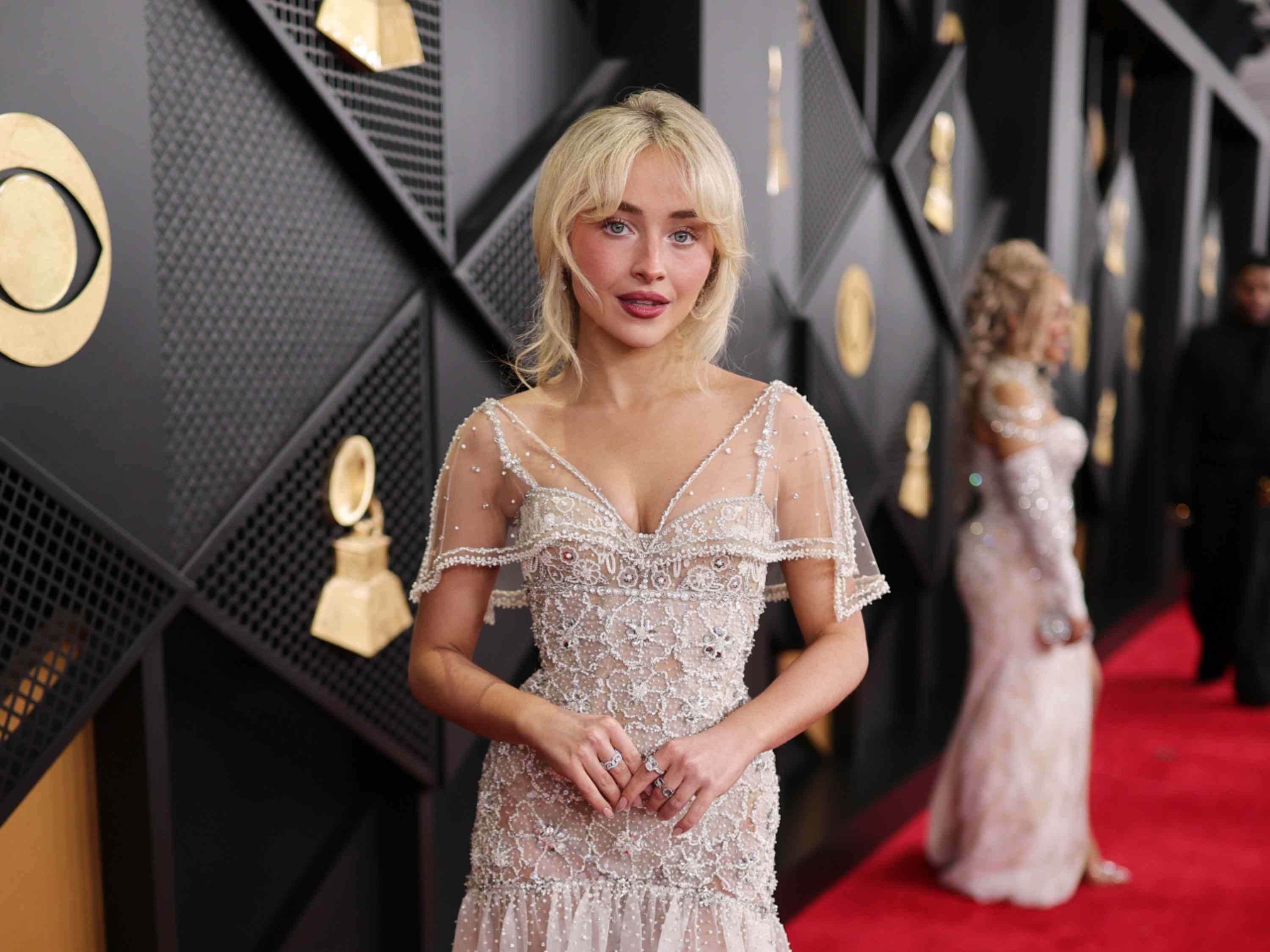 Sabrina Carpenter puts a flirty twist on retro styling with micro shorts, a  lace top, and an unexpected shoe