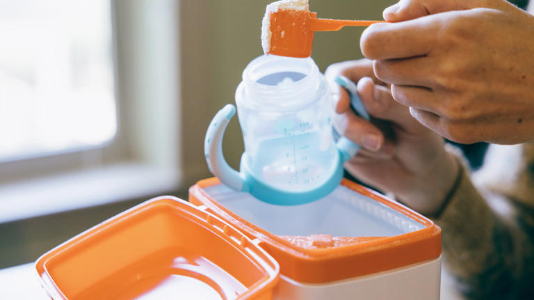Upcycle baby formula cans into a kitchen countertop storage solution
