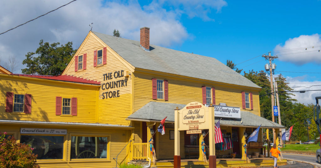 An old-fashioned building with a yellow exterior in Moultonborough, New Hampshire, labeled