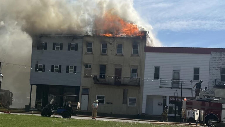 Fire destroys two buildings; investigation underway