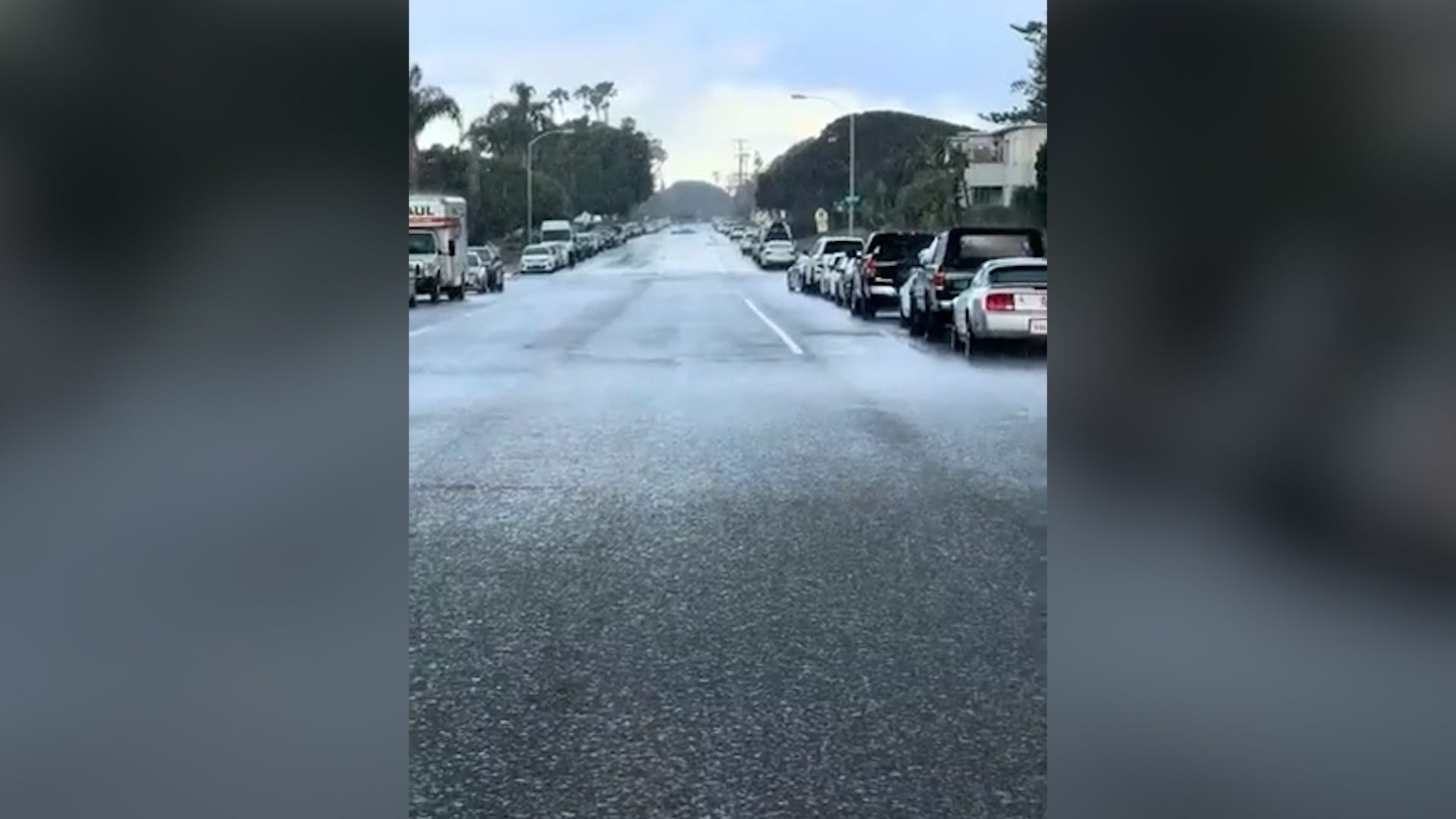 'It's coming!' Wall of rain overcomes woman in 'sci-fi' moment