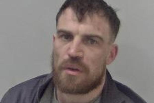Police hunt for wanted man in connection with robbery