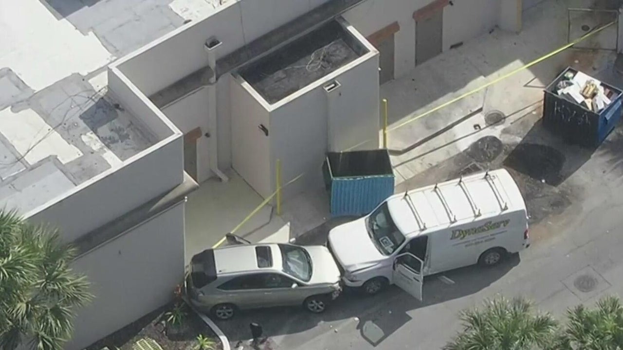 Woman shot in Coral Springs shopping plaza, 1 person in custody