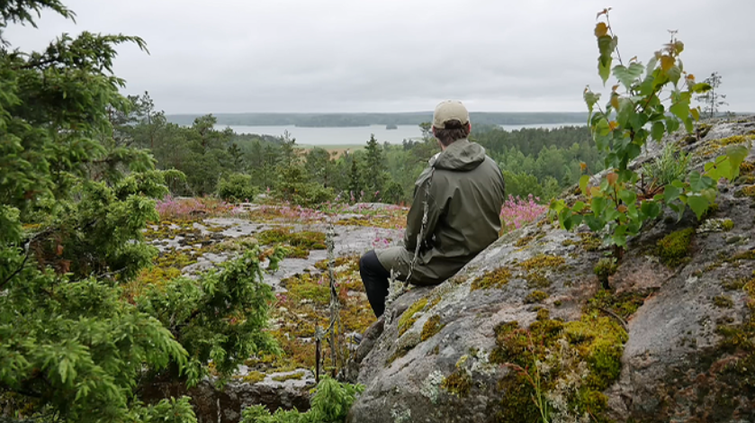 Heavy rain camping tarp shelter build on a hill