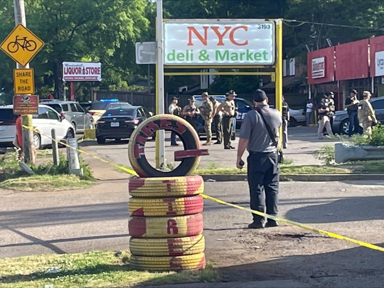 One dead, two critical in targeted shooting at strip mall