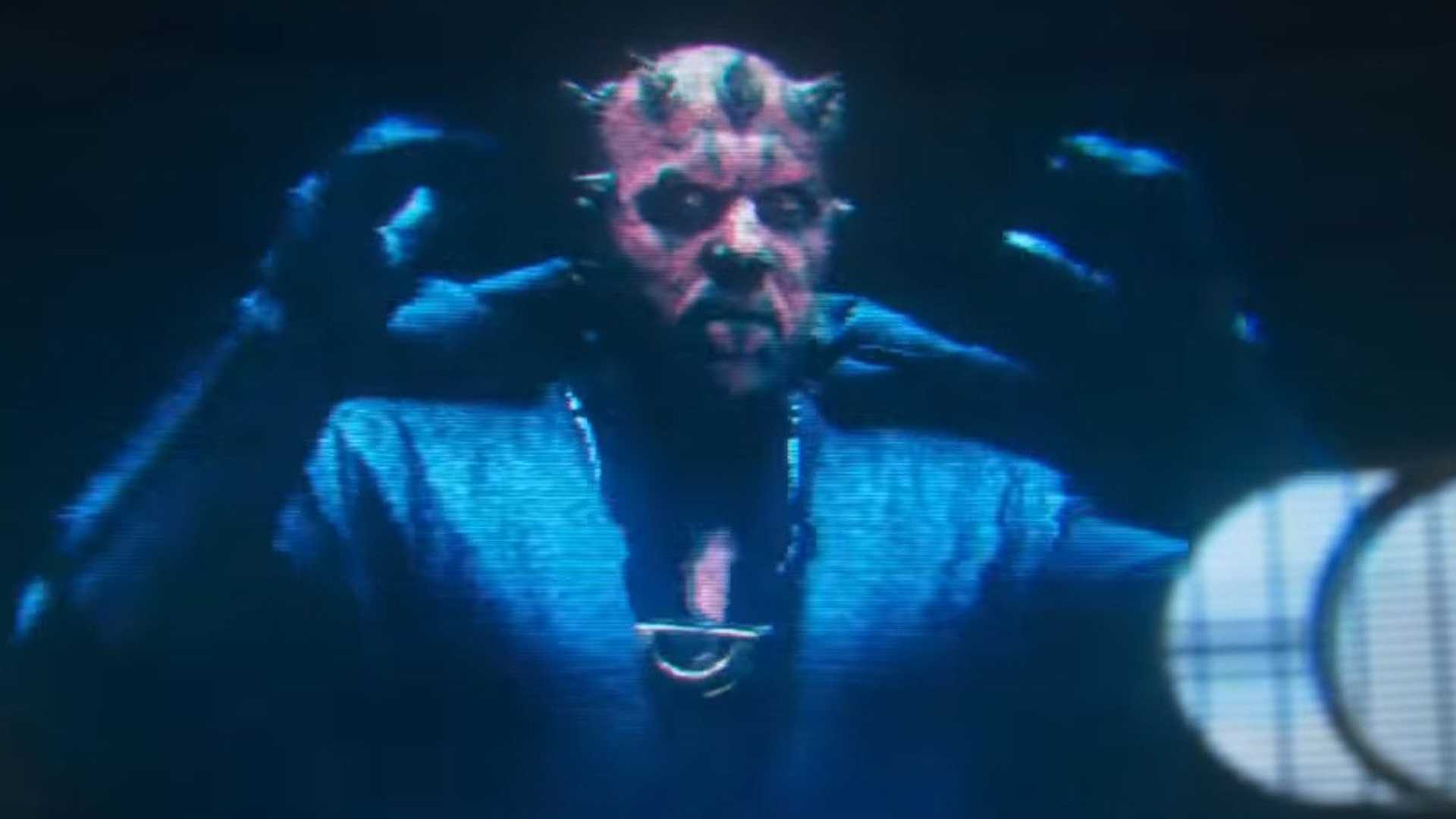 A hologram of Darth Maul reaching up for his hood in Solo A Star Wars Story