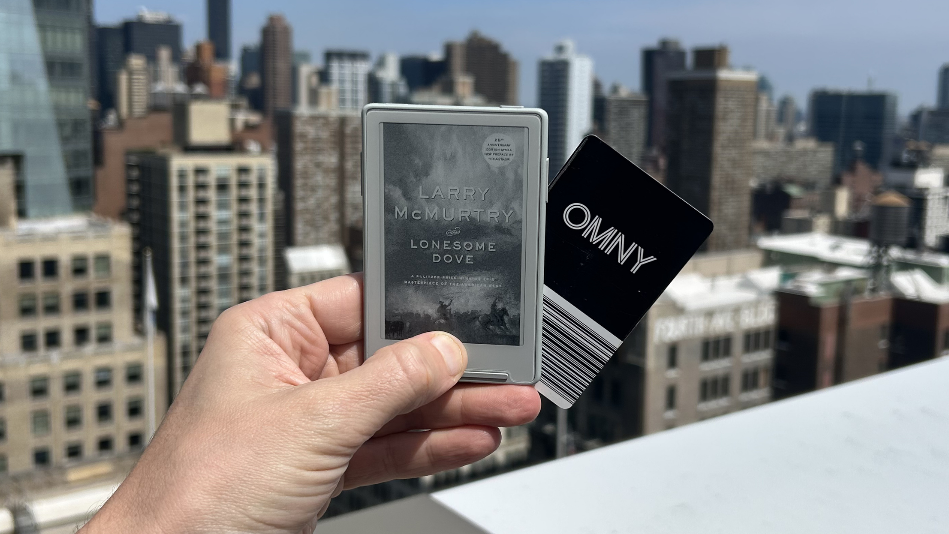 I'm reading a 900-page novel on an e-reader the size of my library card ...