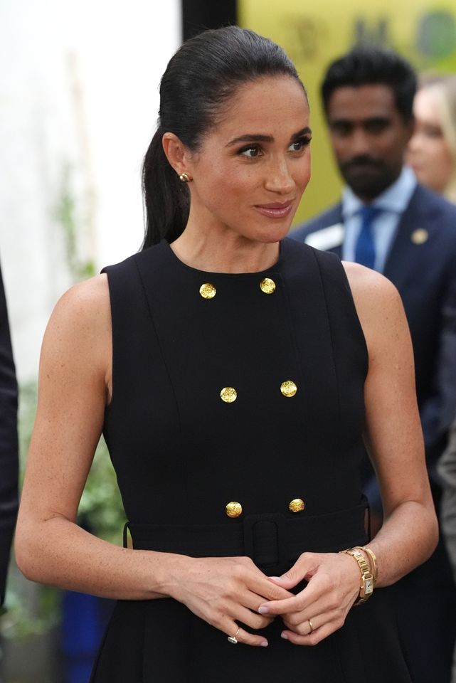Meghan Markle masterfully fuses Californian and Australian style in  monochromatic look with gold accessories