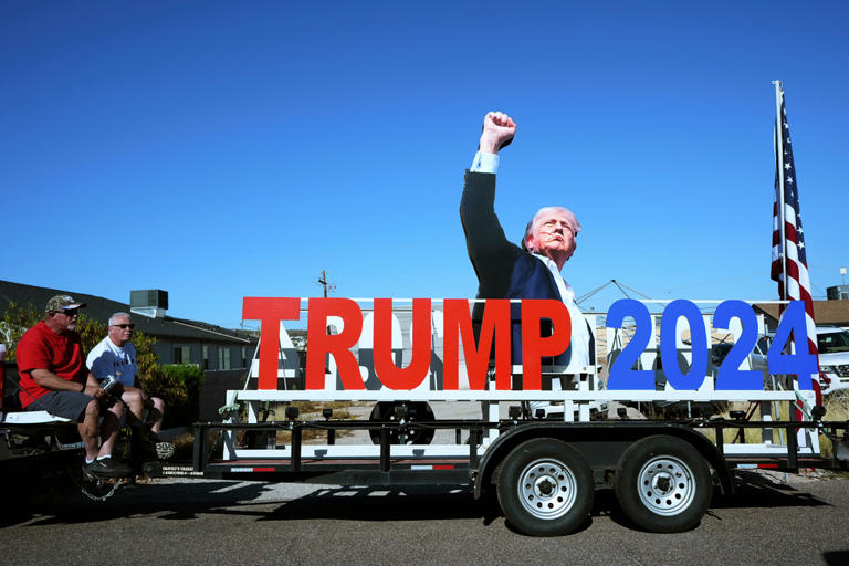 Photos show the 'Build the Red Wall' rally in Arizona, headlined by Trump