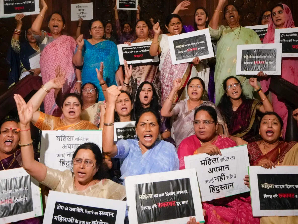BJP women MPs protest outside Parliament after defeat of Constitution ...