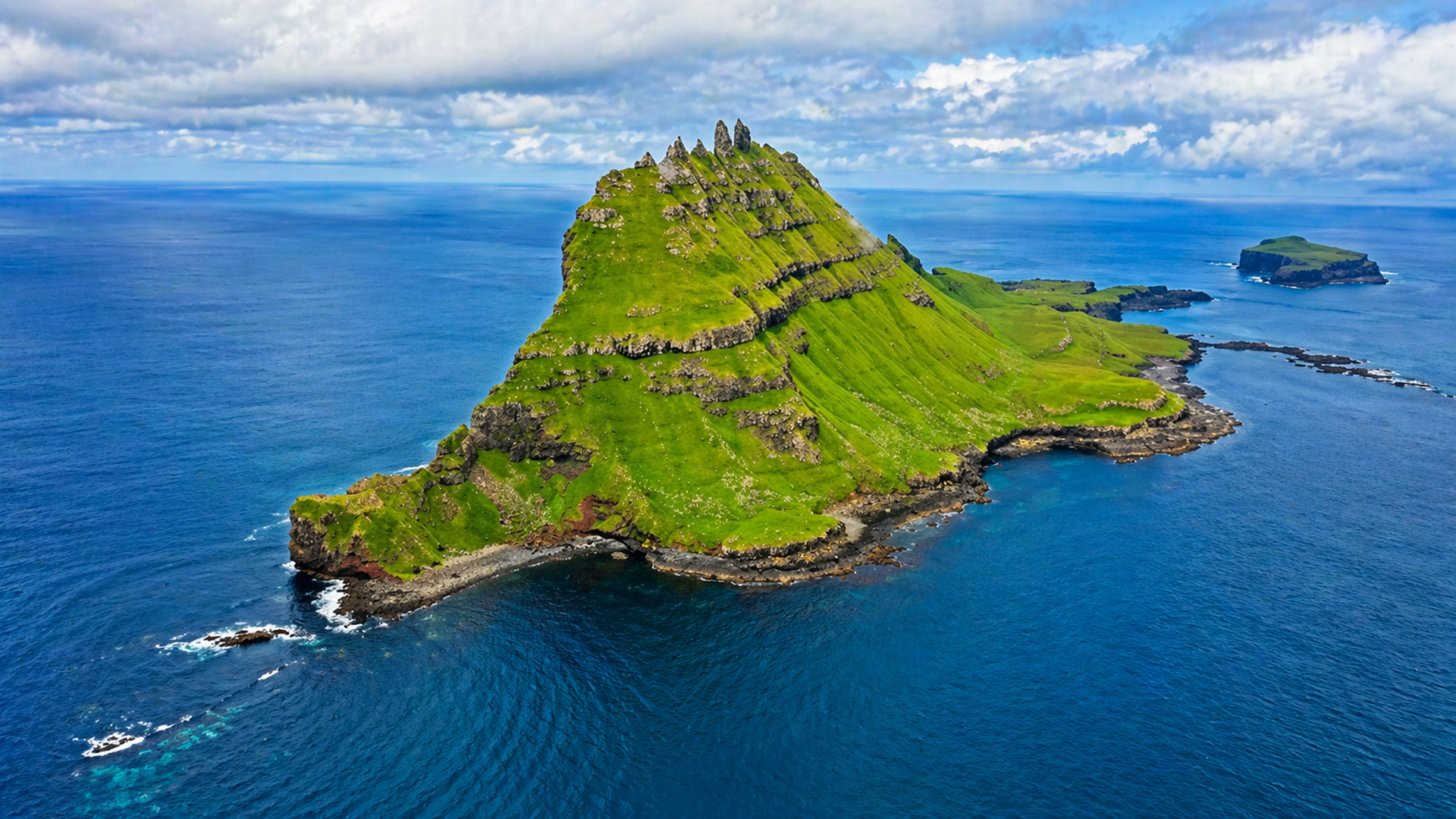 A remote island standing alone in the middle of the ocean