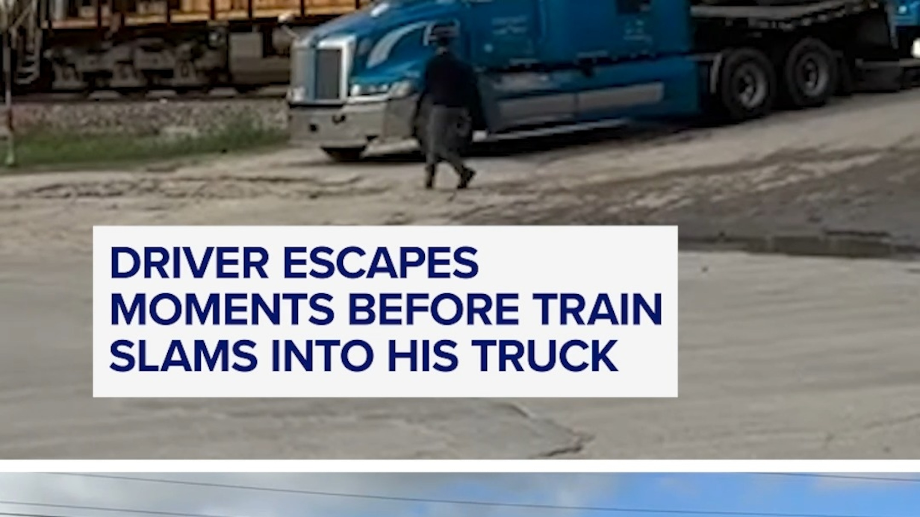 Driver escapes moments before train slams into his truck