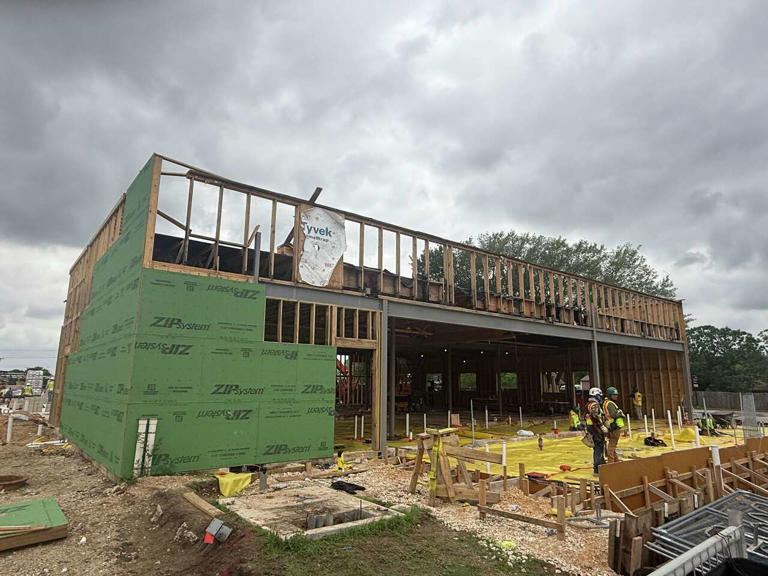 Black's Barbecue expands as family rival construction ramps up next door