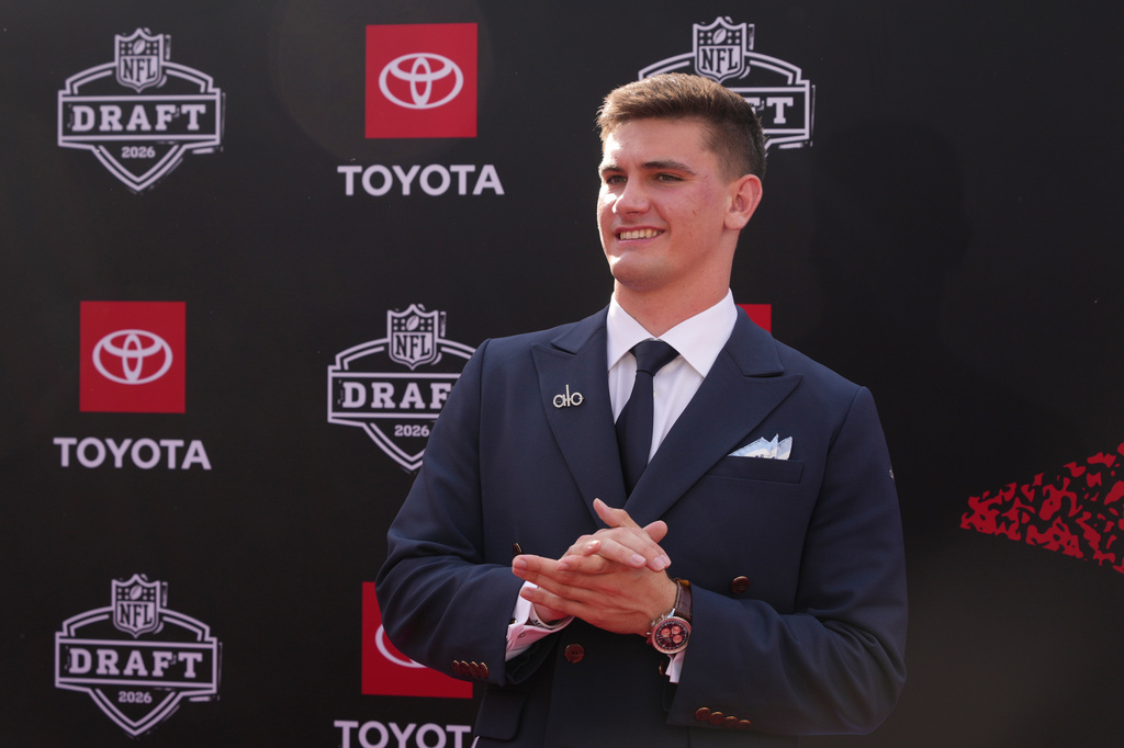 Inside the NFL draft suits: Family photos, sponsor art and a comic book ...