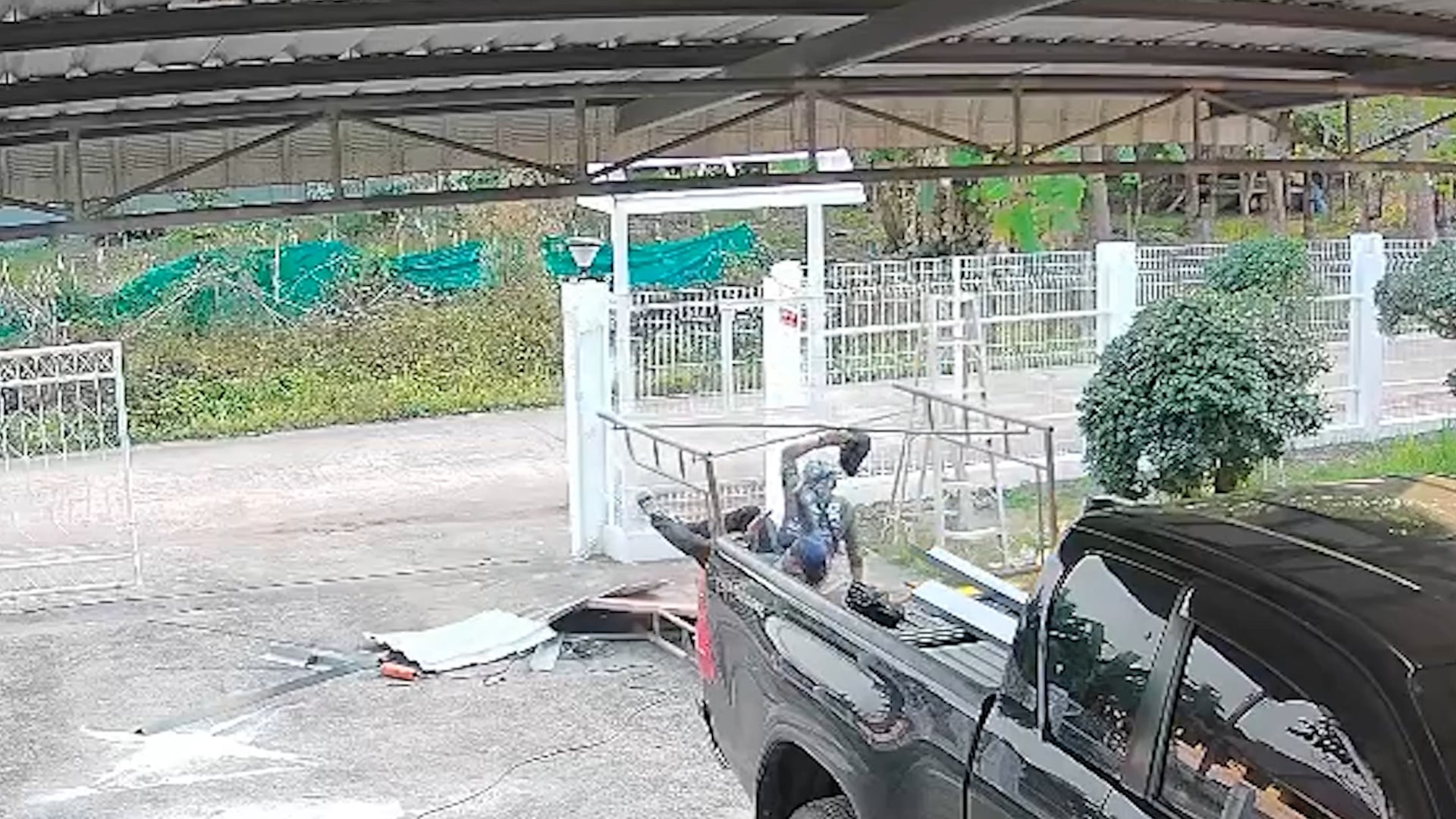 Bungling builders fall off stepladder while repairing roof