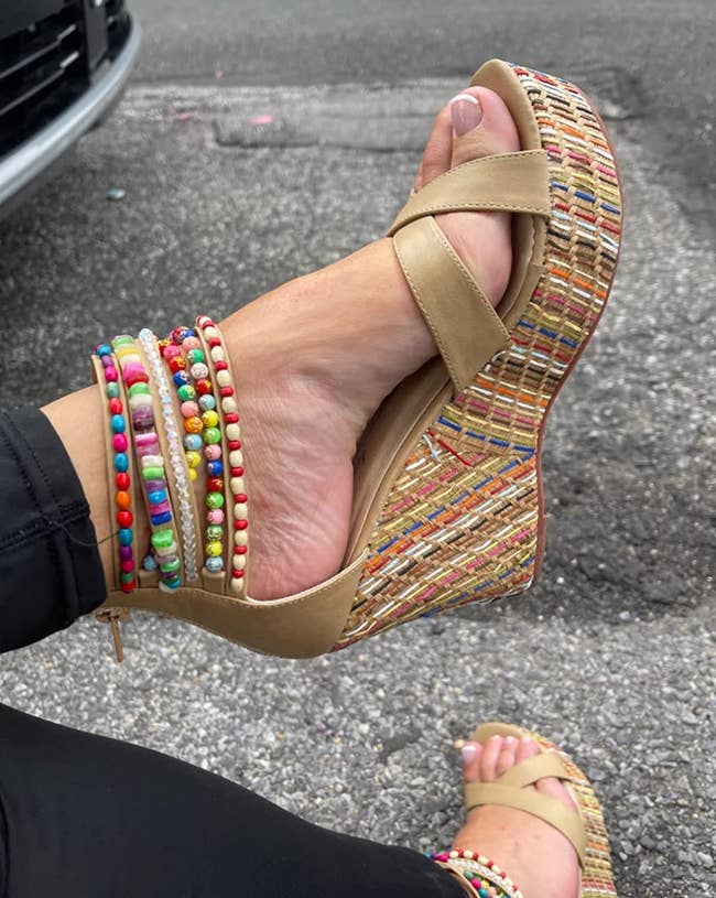 close up of the beige wedges on a reviewer