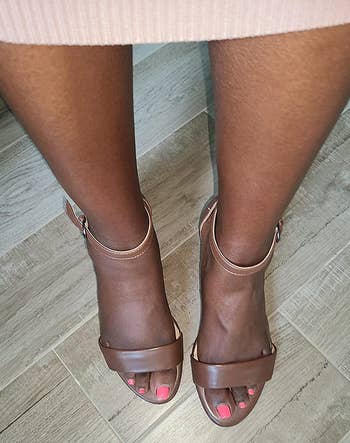 overhead view of reviewer wearing the brown heels