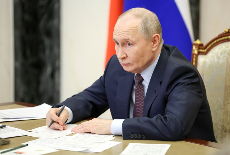 Russian President Vladimir Putin chairs a meeting in Moscow