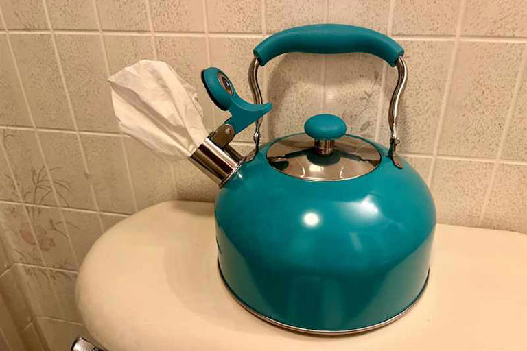 I put a tea kettle in my bathroom, and it's the cutest storage trick I ...