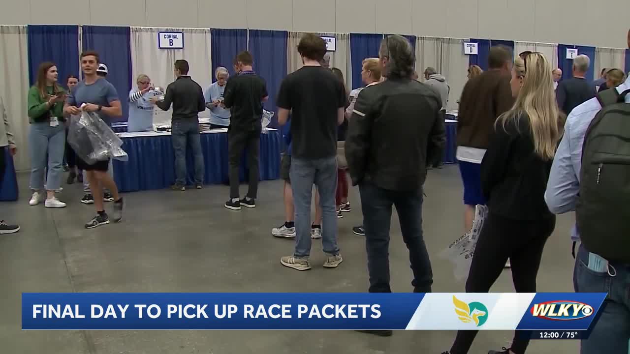 Runners pick up race packets ahead of the Kentucky Derby Festival ...