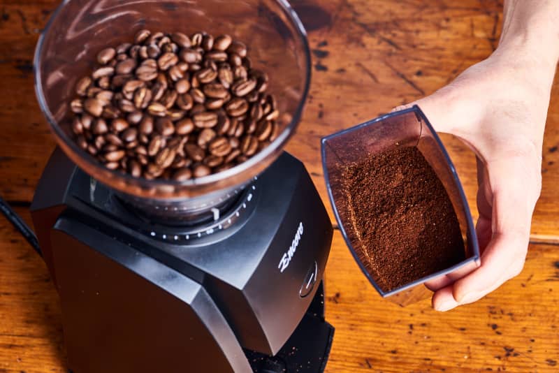 coffee grinds sit in a coffee grinder