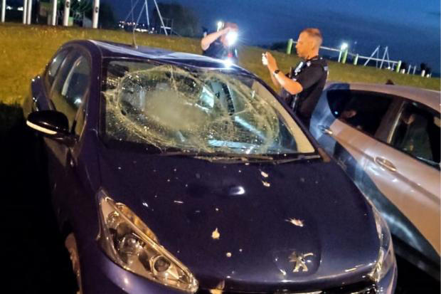 Driver tells of upset as gang of teens 'jumped on top of car and filmed it'