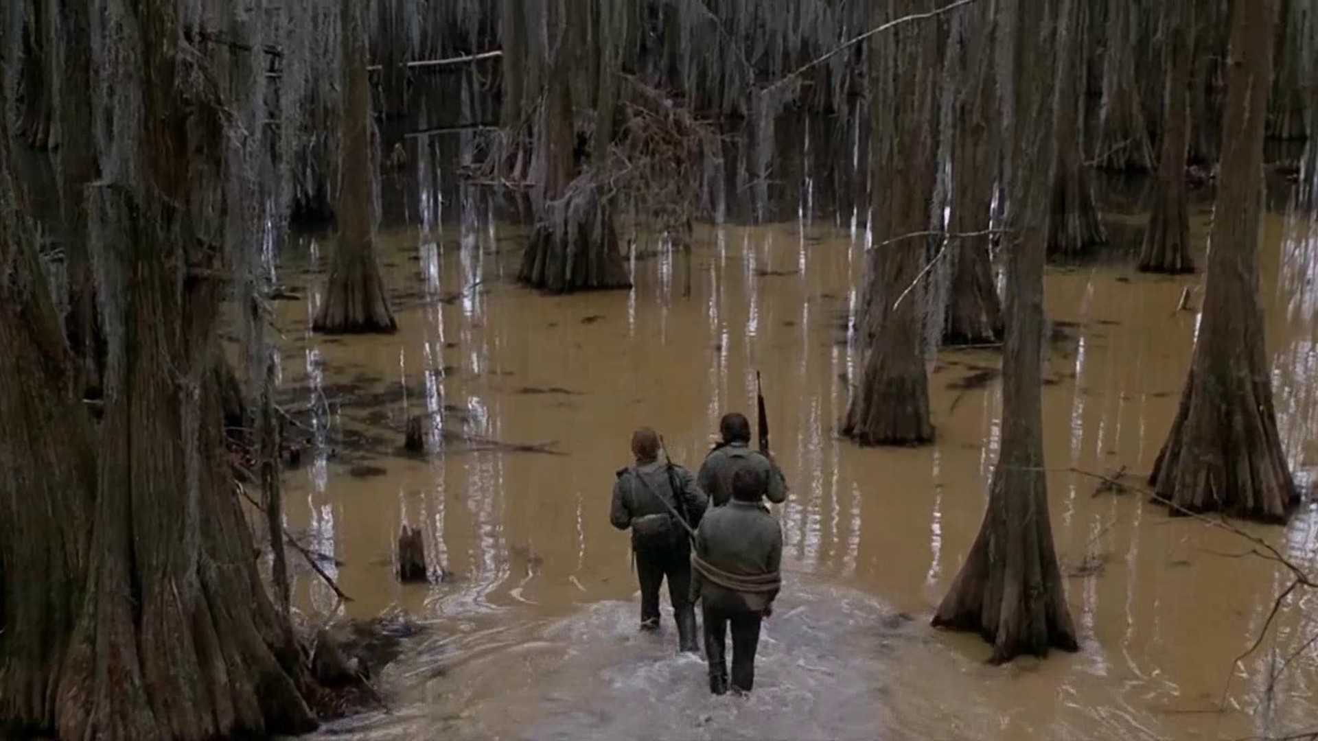 The soldiers walk through the swamp in Southern Comfort