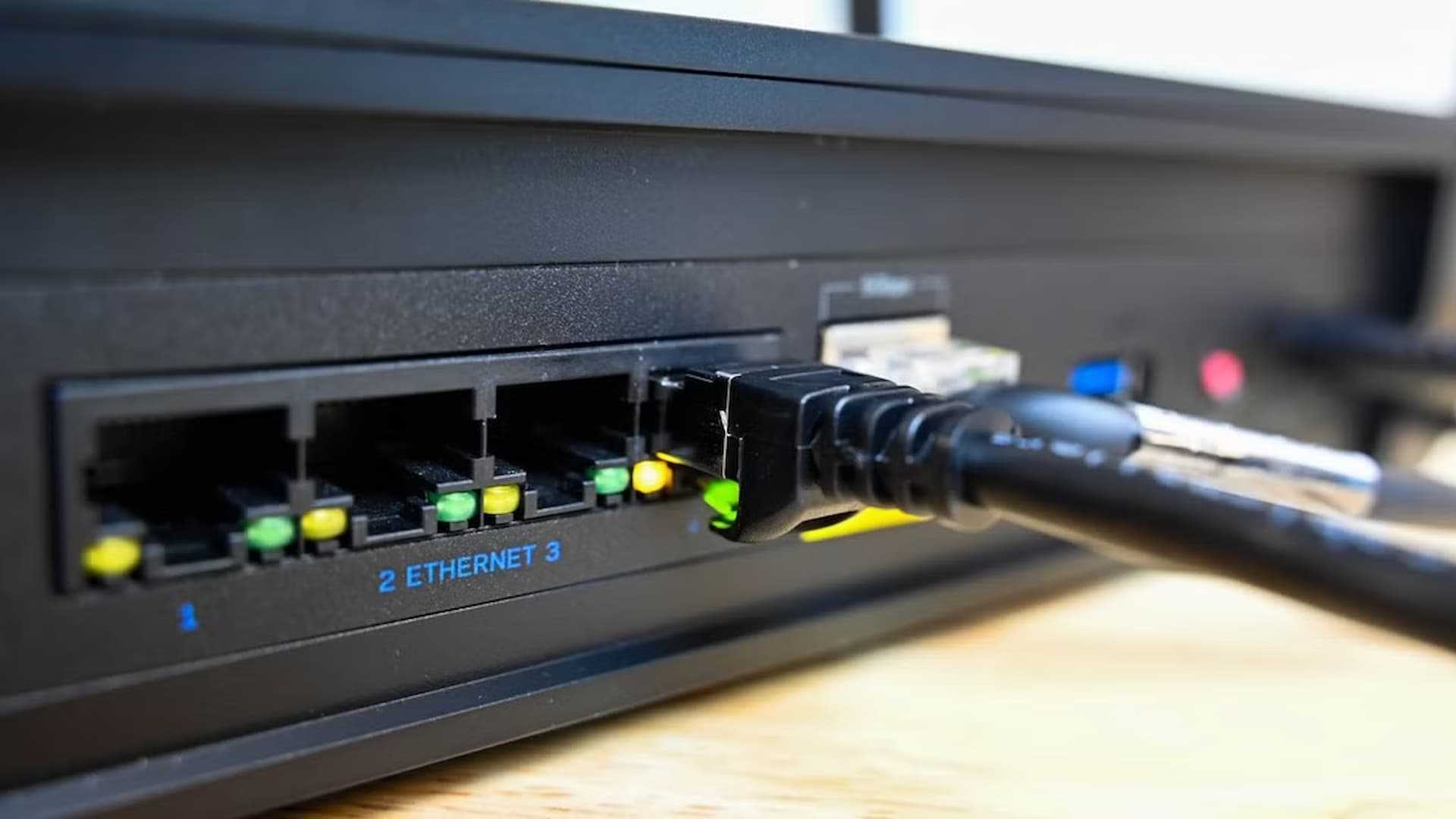A router with ethernet cable plugged in.