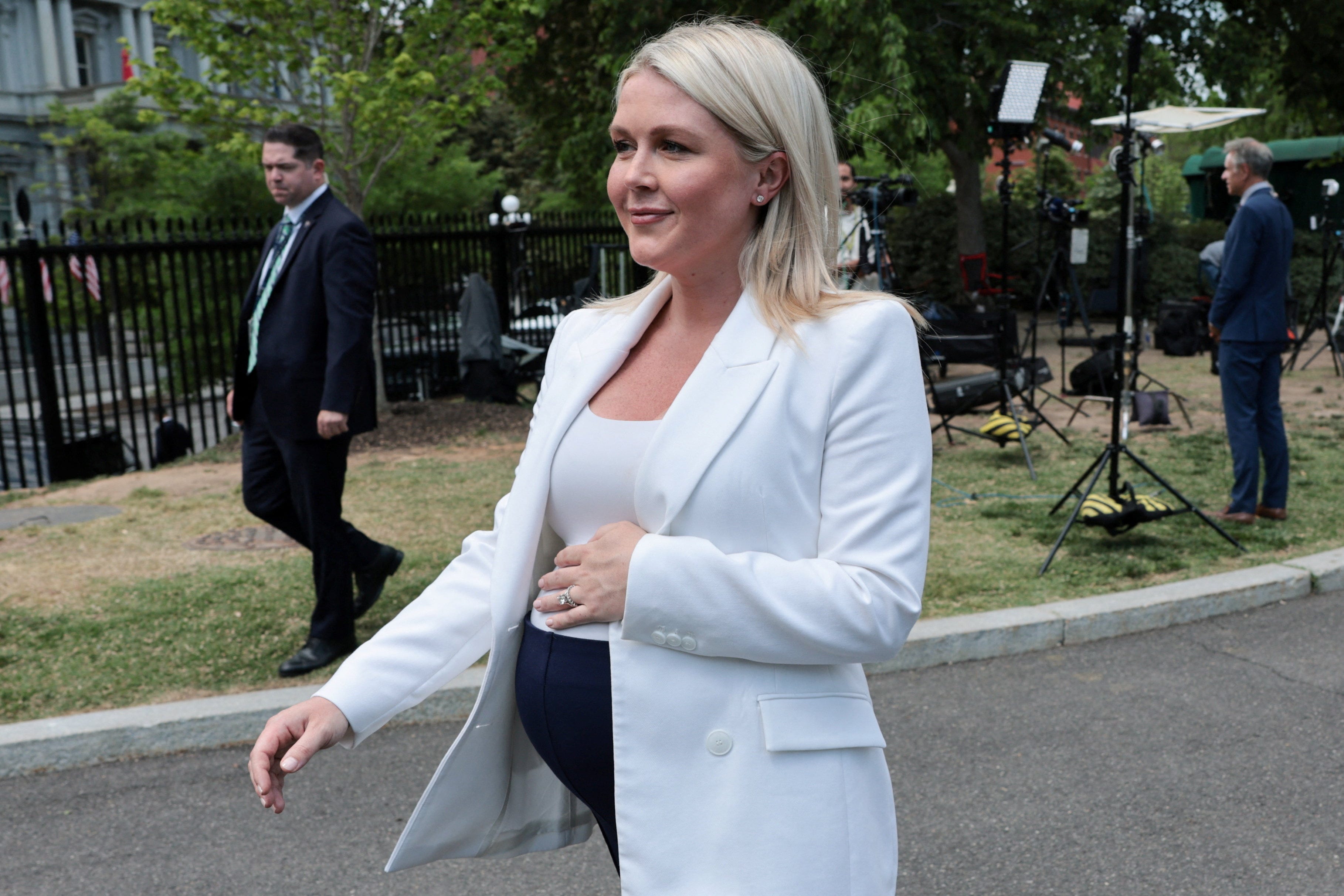 White House Press Secretary Karoline Leavitt walks back to her office after speaking with reporters, telling them it was probably her final press availability before the impending birth of her baby, on the West Wing driveway at the White House in Washington, D.C., U.S., April 24, 2026. REUTERS/Jonathan Ernst