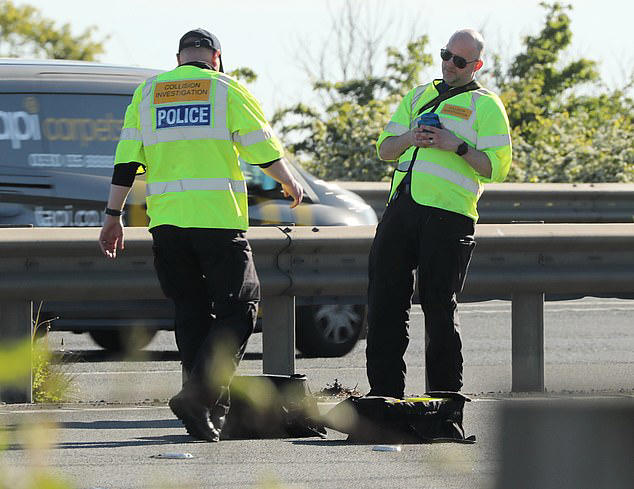 Four people rushed to hospital after ambulance flips on its side in ...