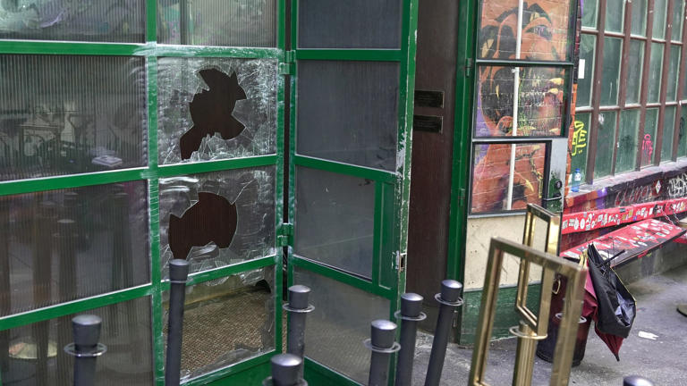 A bar had its windows smashed and was set alight in Melbourne's CBD. (ABC News: Patrick Rocca)