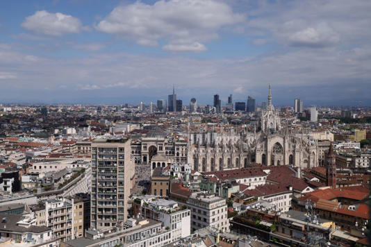 A view of Duomo Cathedral and in the background Porta Garibaldi business district, in Milan, Italy, April 22, 2026. REUTERS/Claudia Greco