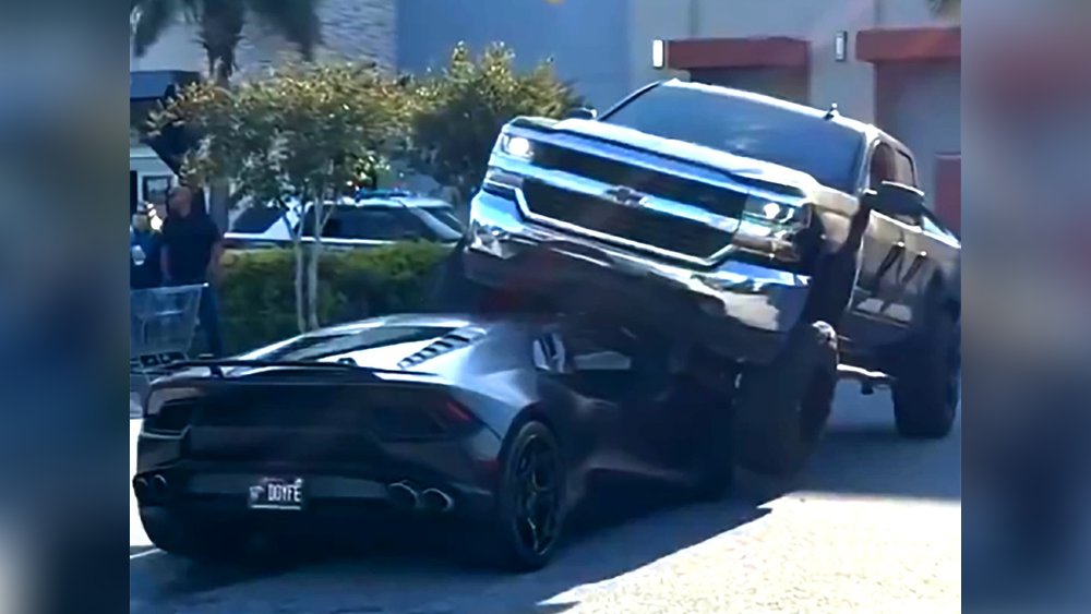 Pickup truck crushes Lamborghini in parking lot