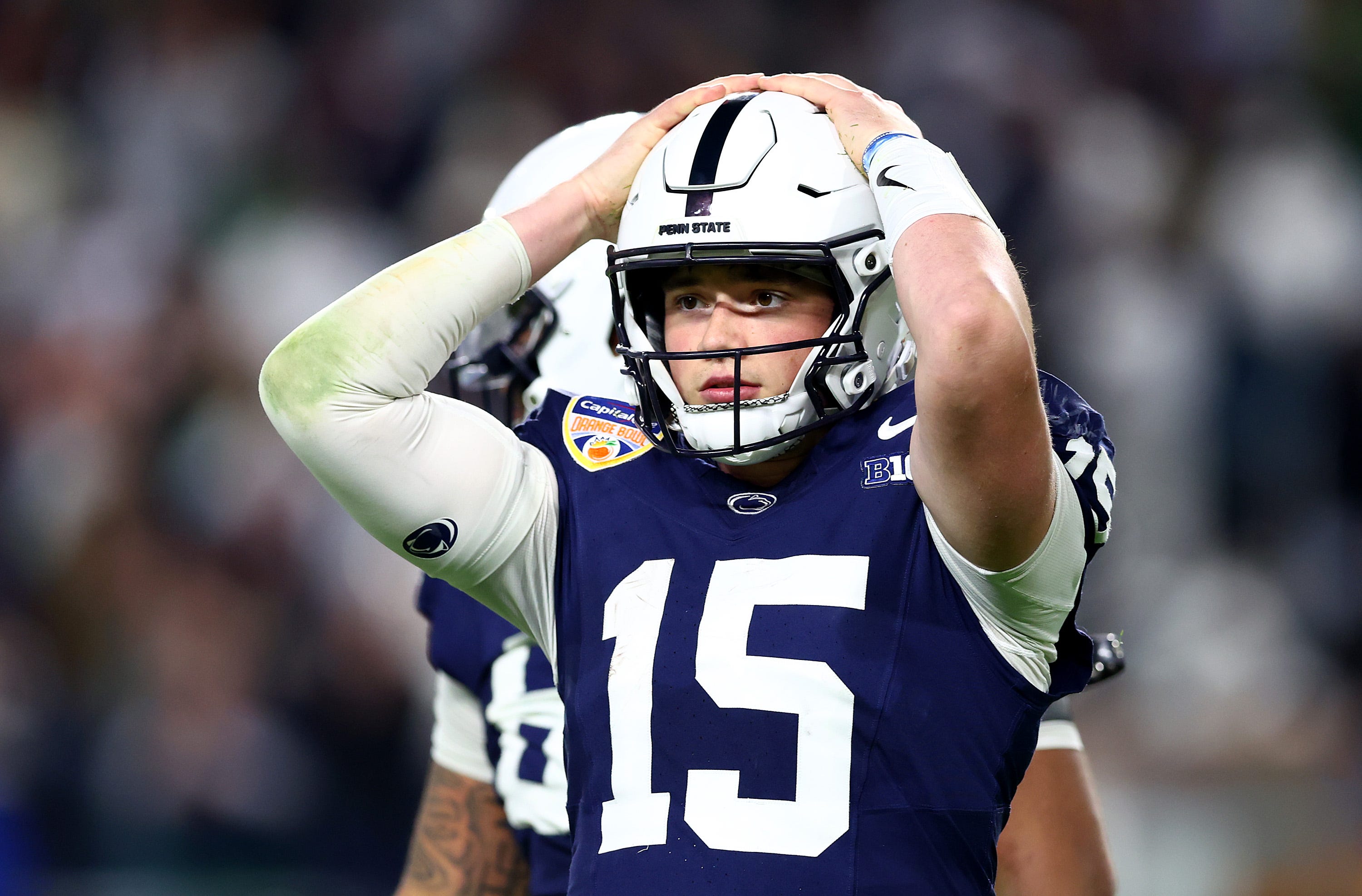 Drew Allar #15 of the Penn State Nittany Lions reacts after throwing an interception during the fourth quarter against the Notre Dame Fighting Irish in the Capital One Orange Bowl at Hard Rock Stadium on January 09, 2025 in Miami Gardens, Florida.