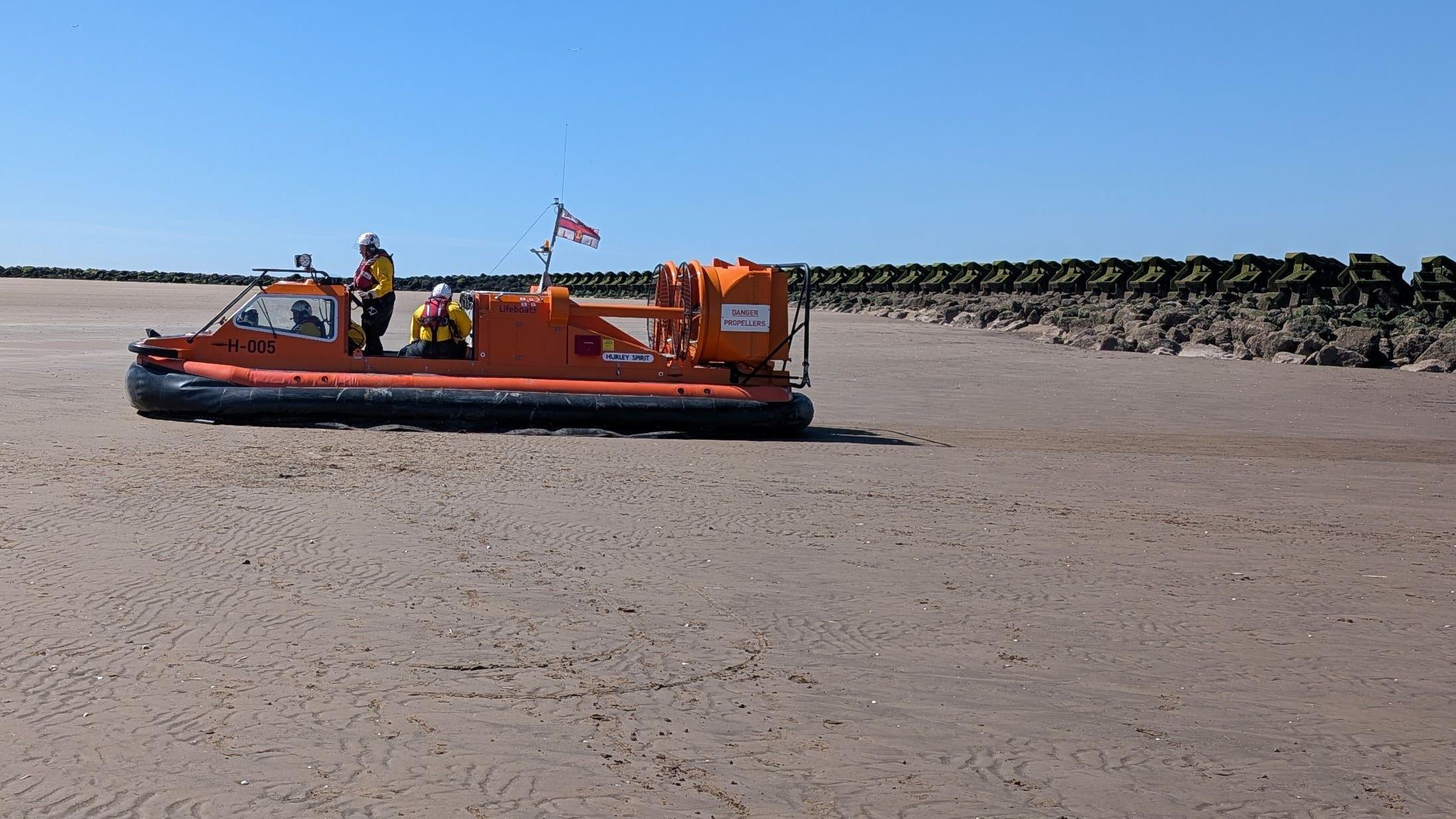 Woman rescued from wheelchair stuck in sand
