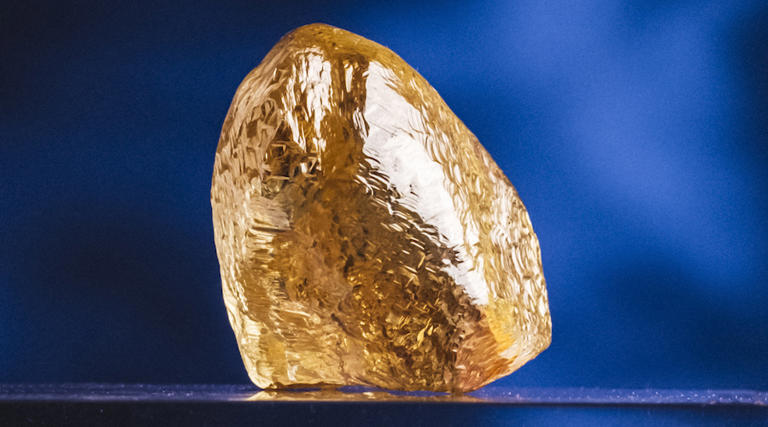 Buried for 2 billion years, miners pulled a rare 158-carat yellow ...