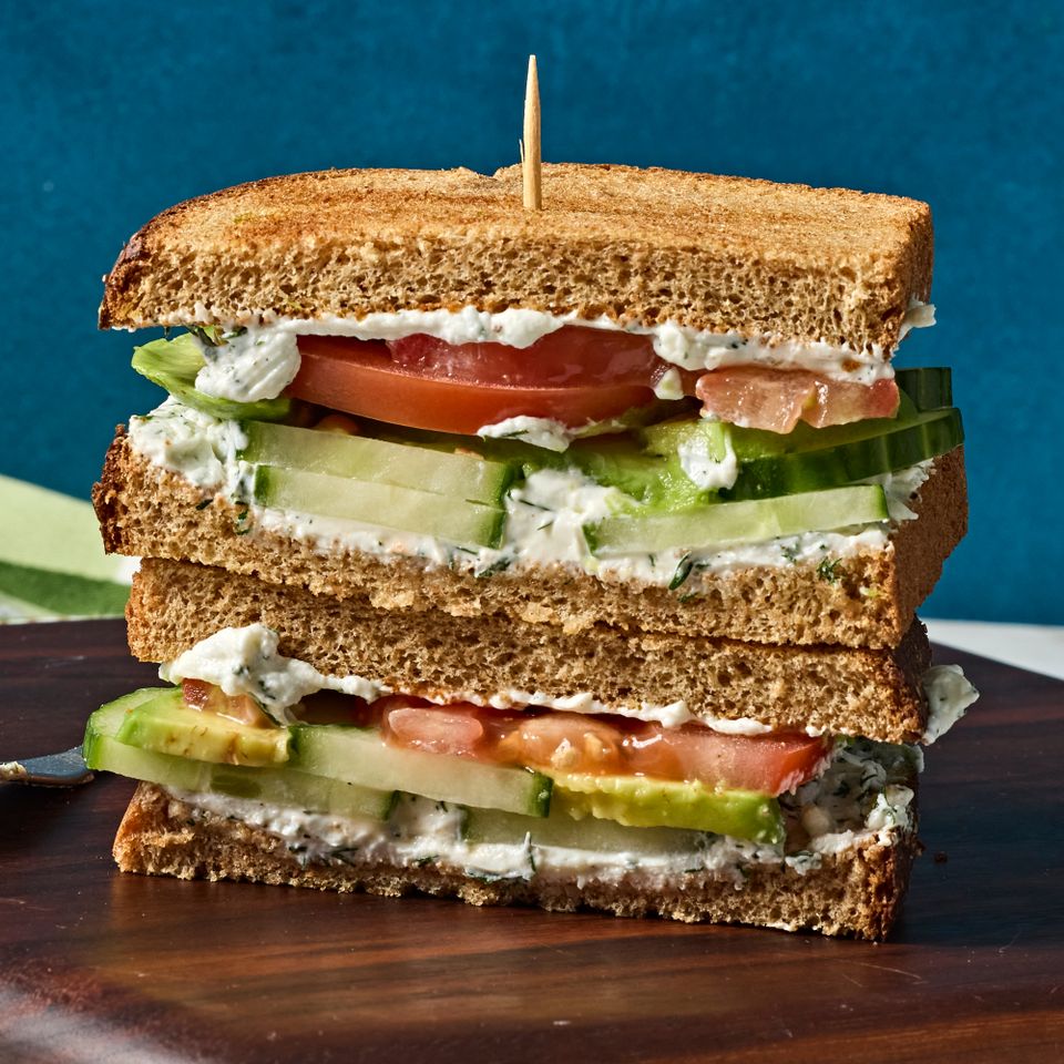 A recipe image of Cucumber, Avocado, Tomato & Goat Cheese Sandwich.